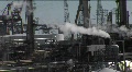 Steam Rises From An Industrial Area.