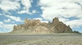 Fluffy White Clouds Pass Over New Mexico's Shiprock.