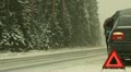 Man Near Broken Car In Snow Storm