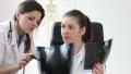 Two Female Doctors Looking At Xray Picture, Tracking Shot Hd