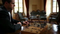 Close Up Of Moving Chess Figures By Two Business Men