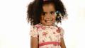 Funny Mixed Race Black And Brazilian Little Girl Isolated With Bubbles Floating