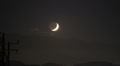 300mm Zoom Thin Crescent Moon With Earthlight Sets Behind Mountain Time Lapse