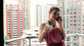 Woman Talking On Cellphone And Drink Coffee On Balcony Hd