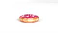 Doughnut With Pink Glaze And White Icing In Motion