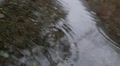 Slow Motion Close Up Footage Of Raindrops Falling On Pond Reflective Water