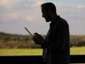 Handsome Man Standing With Tablet On The Terrace In The Country Ntsc
