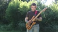 Man Playing On A Electric Guitar In Park
