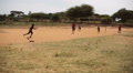 Poor African Kids Play Football Soccer, Running To Camera, Kenya, Africa