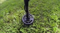 Pov Shot Of Metal Detecting On Lawn