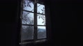 Silhouette Of A Man Looking Through The Window Of An Old House