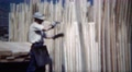 1949: Manual Hand Stacking Of Wood Boards Processing From Lumbermill.