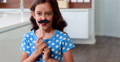 Cute Child With Fake Mustaches Making Faces