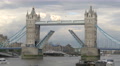 Tower Bridge Open For A White Boat In London
