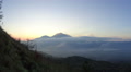 Rolling Clouds Give Way To The Sunrise Over Mount Agung In Bali