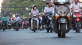 Motorbikes Ride Through The Busy Streets Of Ho Chi Minh City In Vietnam