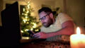 Happy Man Relaxing At Home And Texting On Smartphone