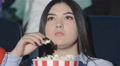Asian Girl With A Bucket Of Popcorn