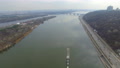 Quadrocopters Flying Over The Cargo Ship Sailing On The River