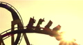 Close Up: Friends On Extreme Roller Coaster Ride At Sunset