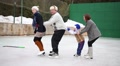 Mother, Father And Two Children Skate As Train At Rink In Winter Day