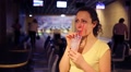 Happy Beautiful Woman Drinks Milk Cocktail In Bowling