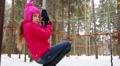 Girl Rides On Bungee In Monkey Park With Rope Path In Winter Forest