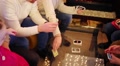 Hands And Knees Of Nine People Playing Table Game With Cards In Room