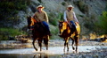 Riders On Horse In Valley Stream Rocky Mountains America