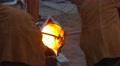 People Working On Metal Casting At Foundry Liquid Iron Is Pouring From A Ladle