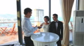 Conjurer Shows Card Trick For Bride Groom In Hotel Lobby