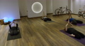 Yoga Group Of Women On Floor Together In Studio