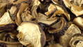 Close Up Of Dried Mushrooms Ratating On Parchment. Seamless Loopable. Prores 4k