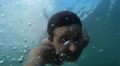 Man Swimming Underwater. Diving, Man Dives And Swims Under Water.