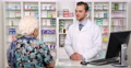 Elderly Woman Shopping Buying Pills In Pharmacy Drugs Medicine Pharmacist Man