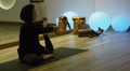 Yoga Instructor On Mat In Studio