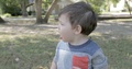 Toddler Looks Around At A Park
