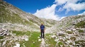 Portrait Of A Man Hiking And Backpacking On A Trail In The Mountains, Time-Lapse