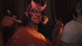 Girl With Horns As Devil Character Dance In Crowd At Night Club Halloween Party