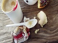 Lipstick Mark On Coffee Cup And Half Eaten Chocolate Doughnut With Sprinkles