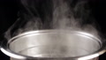 Boiling Water In Steel Pan On Black Background, Slow Motion