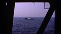1970: A Small Vessel Moving Through The Sea Seen Through Window Of A Ship United