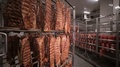 Sausages, Grilled Ribs, Meat Products At A Storage Rack In A Food Factory. Wide