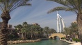 Touristic Abra Boat Sail In Burj Al Arab Exotic Garden Lake In Dubai City Emblem