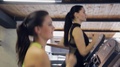 Two Beautiful Women Run In Running Machine In Fitness Center. Closeup Faces