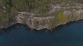 Rocky Shoreline Of The Lake With Forest. Aerial View