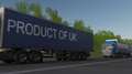 Moving Freight Semi Trucks With Product Of Uk Caption On The Trailer. Road Cargo