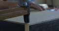 Using Staple Gun To Fix Back Side Of The Closet In Furniture Factory, Closeup