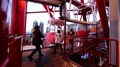 Tourists Board The Moving Cabins Of Daikanransha, A Tall Ferris Wheel In Tokyo