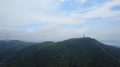 Forested Hills Range, Big Buddha Statue On Summit, Aerial Panorama